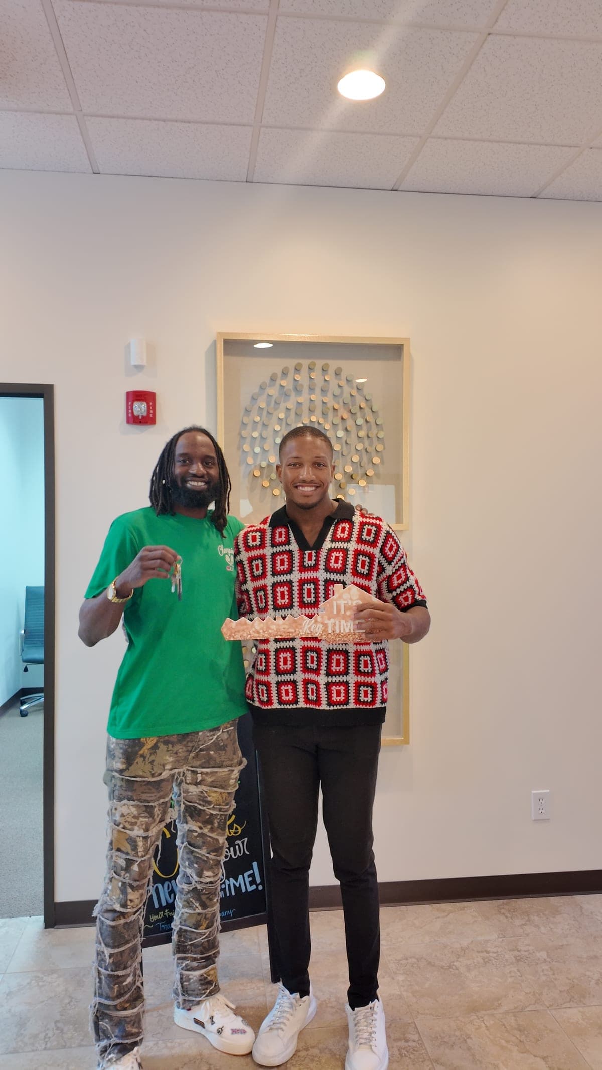 Don Narcisse handing over keys to a client